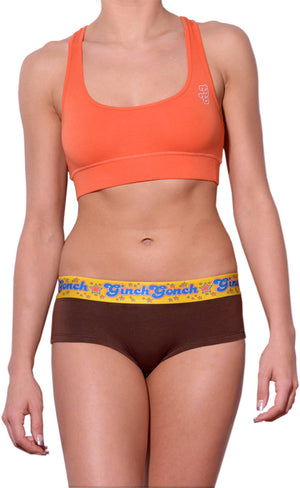 GG Ginch Gonch Lemon Heads women's cheeky boy cut underwear gogo with brown fabric, and a printed yellow waistband. front. shown with orange sports bra