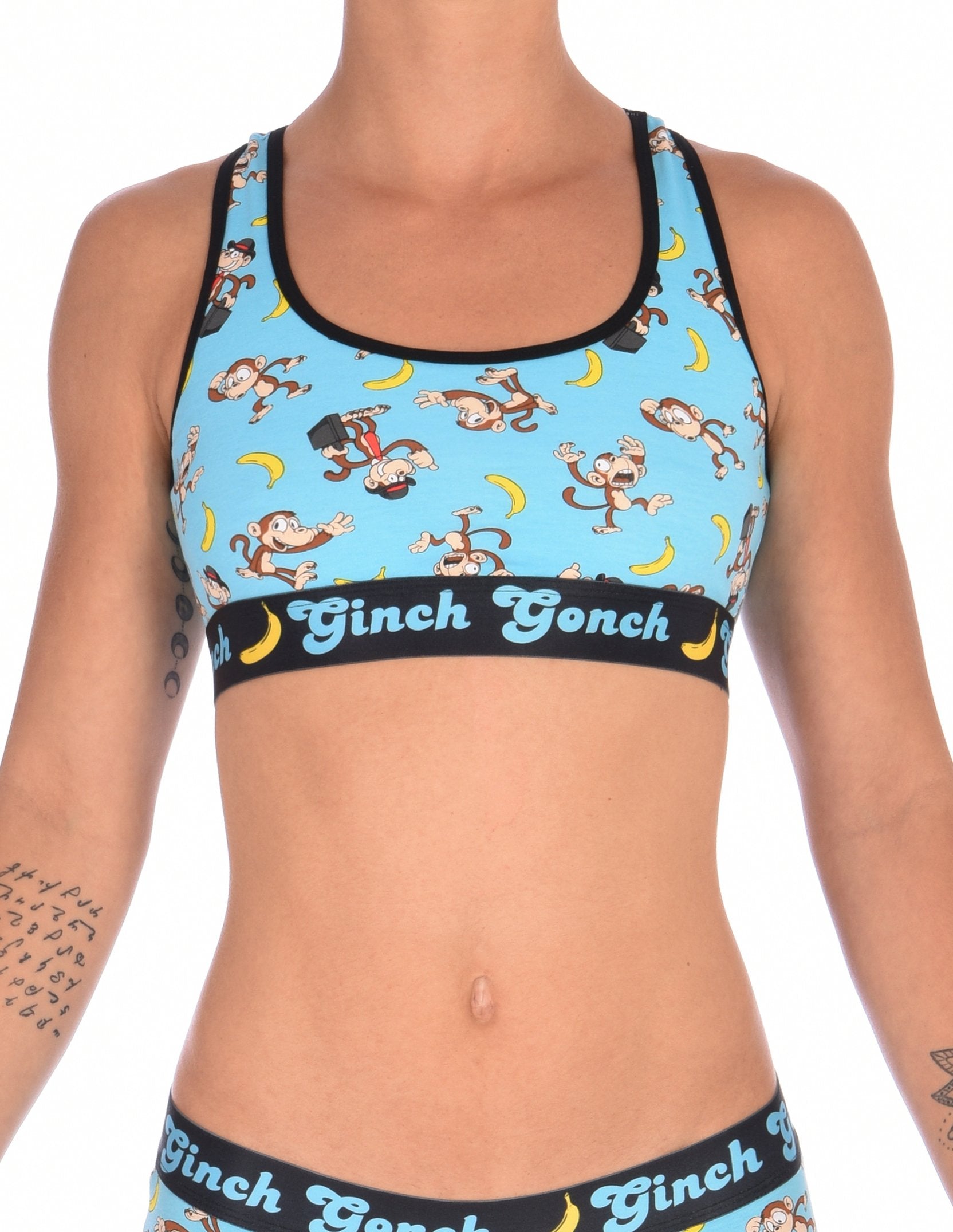 Ginch Gonch Monkey Business Women's Sports Bra Underwear with blue background, monkeys, and bananas. Black trim and printed waistband with Ginch Gonch and bananas. Front.