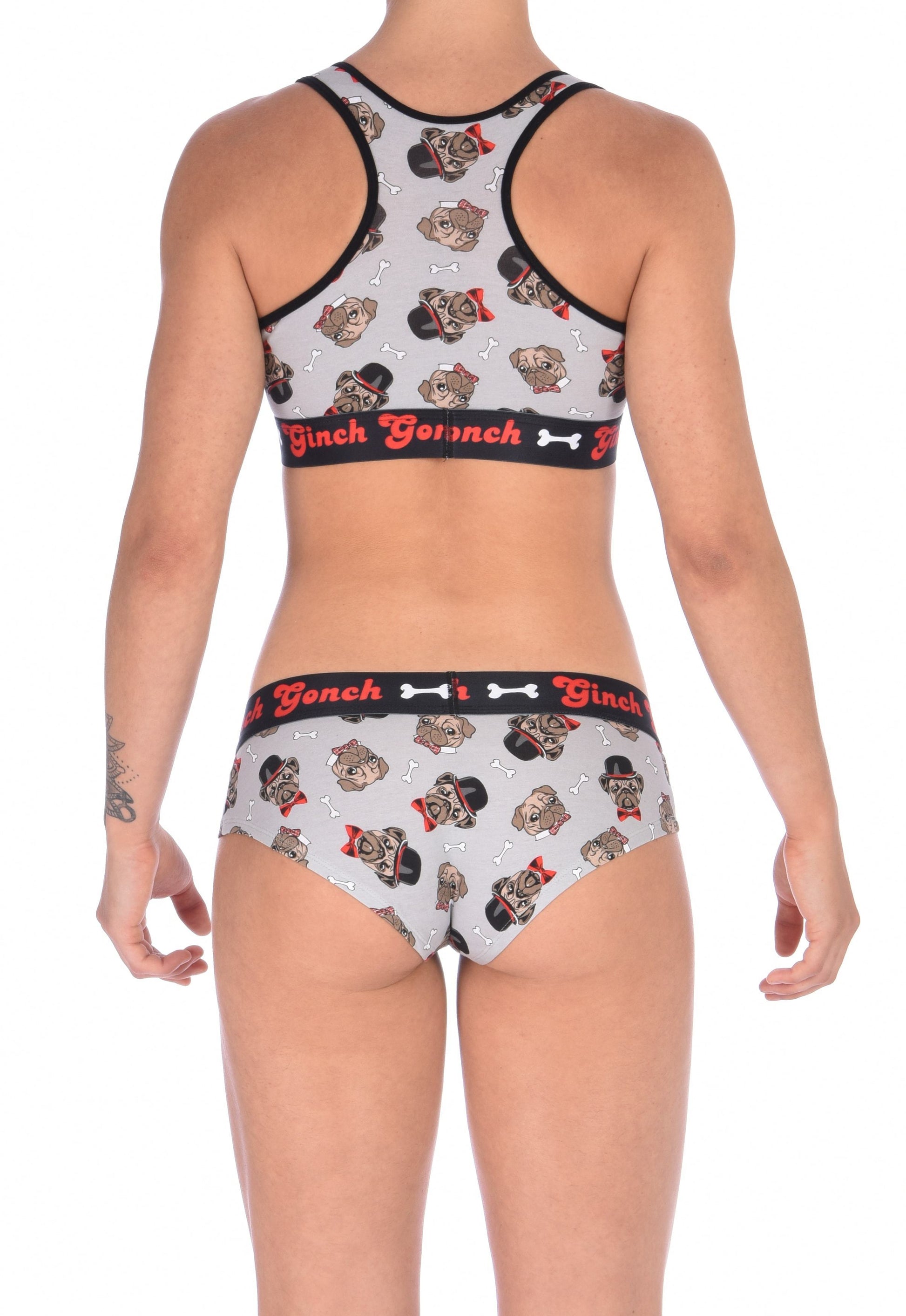 GG Ginch Gonch Pug Life boy cut brief cheeky gogo - women's Underwear grey background with pugs with top hats and bow ties and bones. Black trim with black printed waistband back. Shown with matching sports bra