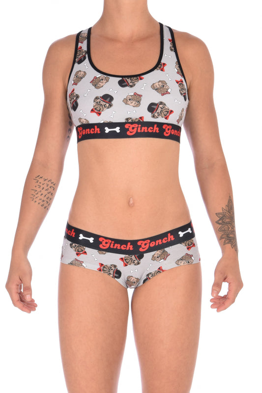 GG Ginch Gonch Pug Life boy cut brief cheeky gogo - women's Underwear grey background with pugs with top hats and bow ties and bones. Black trim with black printed waistband front. Shown with matching sports bra