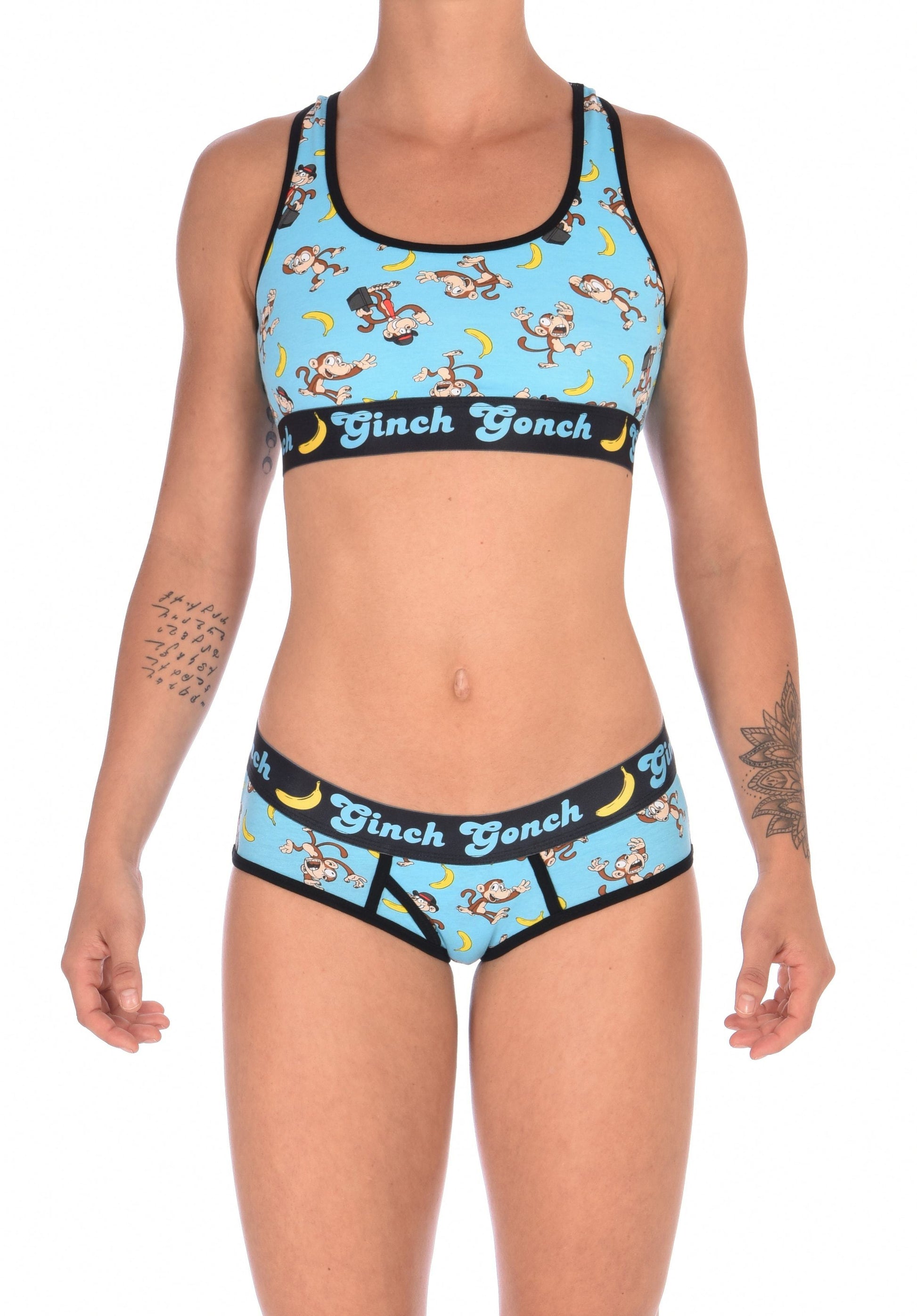 Ginch Gonch Monkey Business Women's Underwear boy cut brief with y front, with blue background, monkeys, and bananas. Black trim and printed waistband with Ginch Gonch and bananas. Front. Matching Sports bra