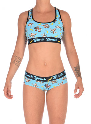 Ginch Gonch Monkey Business Women's Underwear boy cut brief, gogo, with blue background, monkeys, and bananas. Black trim and printed waistband with Ginch Gonch and bananas. Front. With matching sports bra.