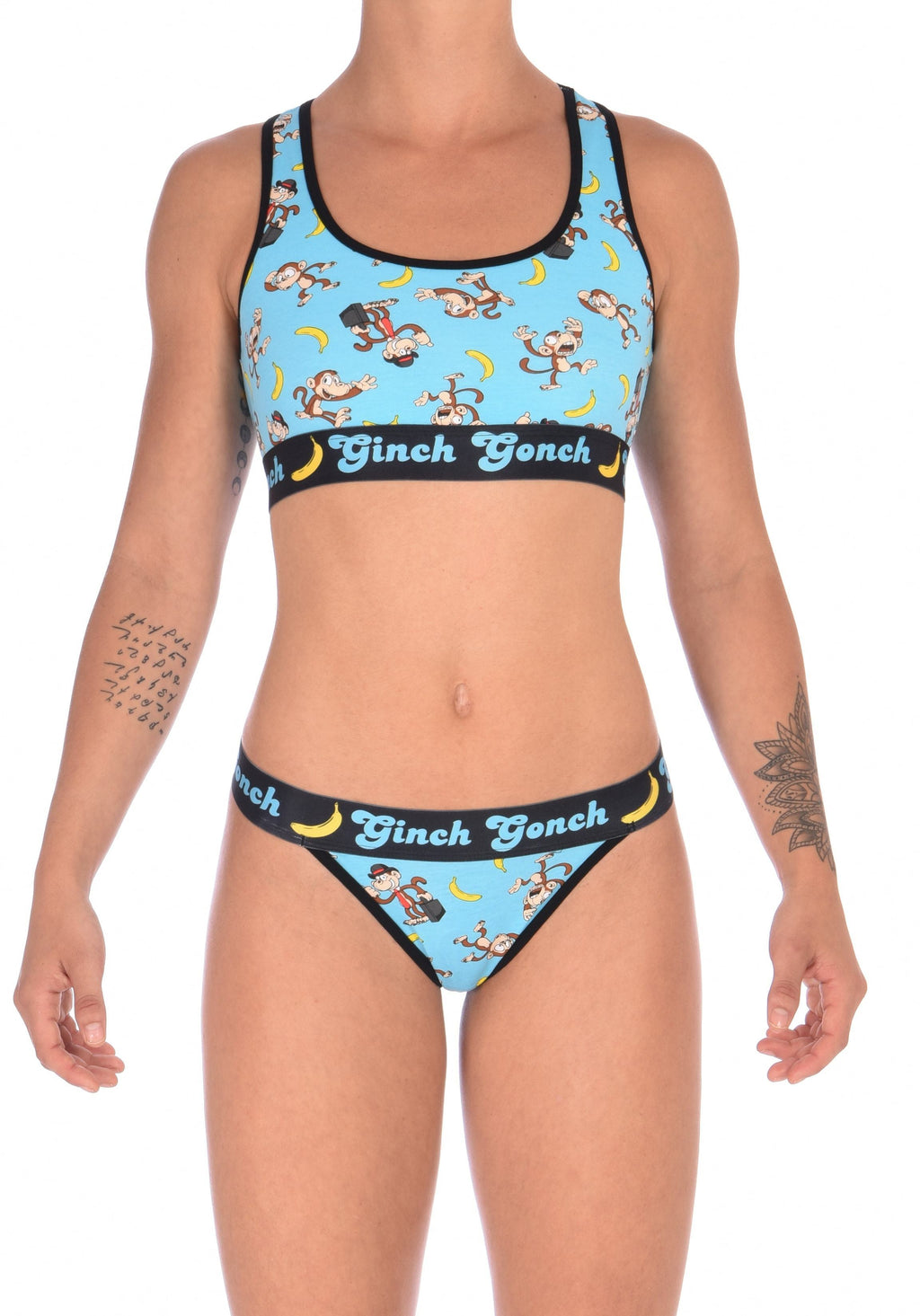 Ginch Gonch Monkey Business Women's Thong Underwear with blue background, monkeys, and bananas. Black trim and printed waistband with Ginch Gonch and bananas. Front. With matching sports bra.