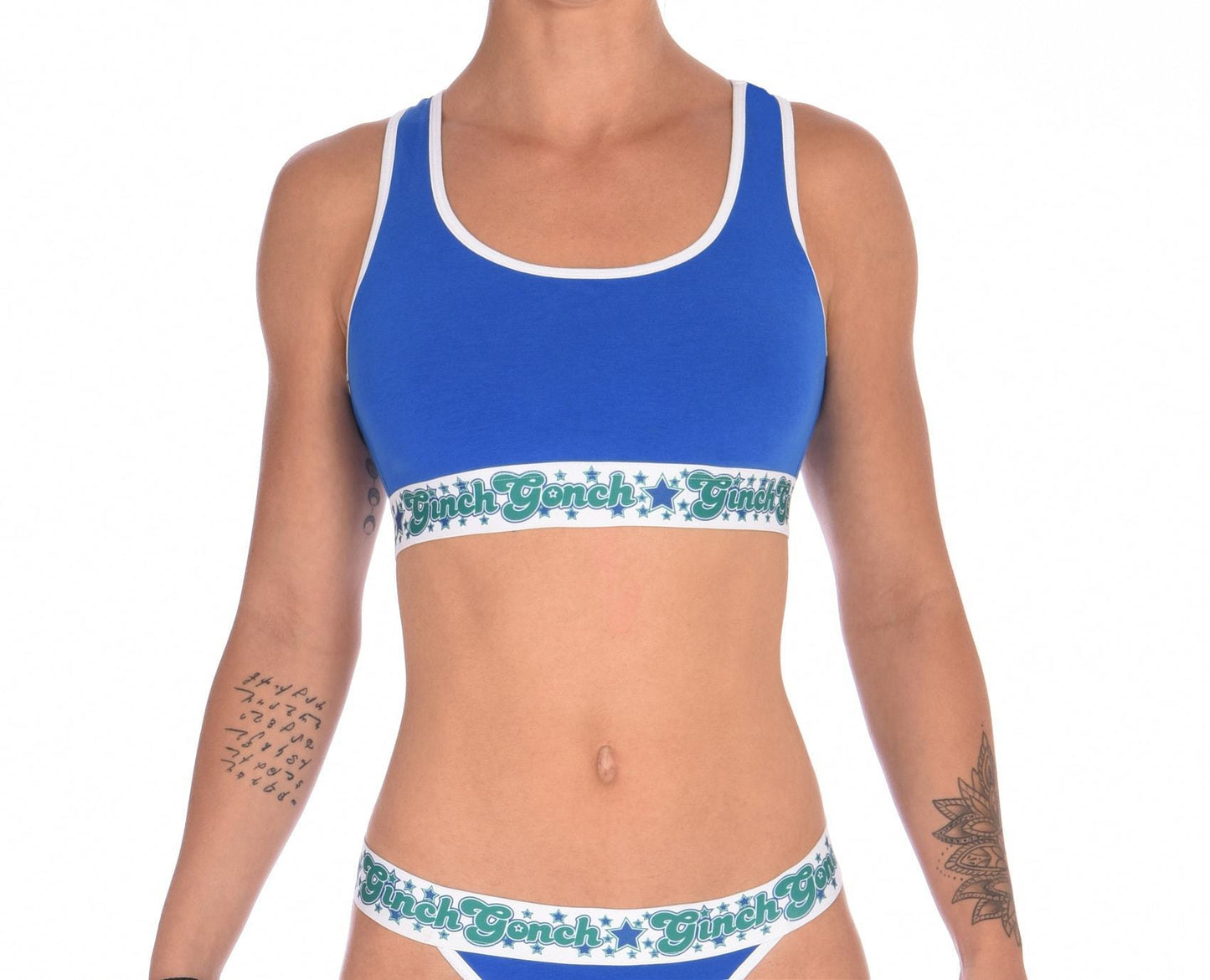 ginch gonch blue lagoon women's sports bra blue fabric with white trim printed thick band with ginch gonch logo and stars in blue and green front