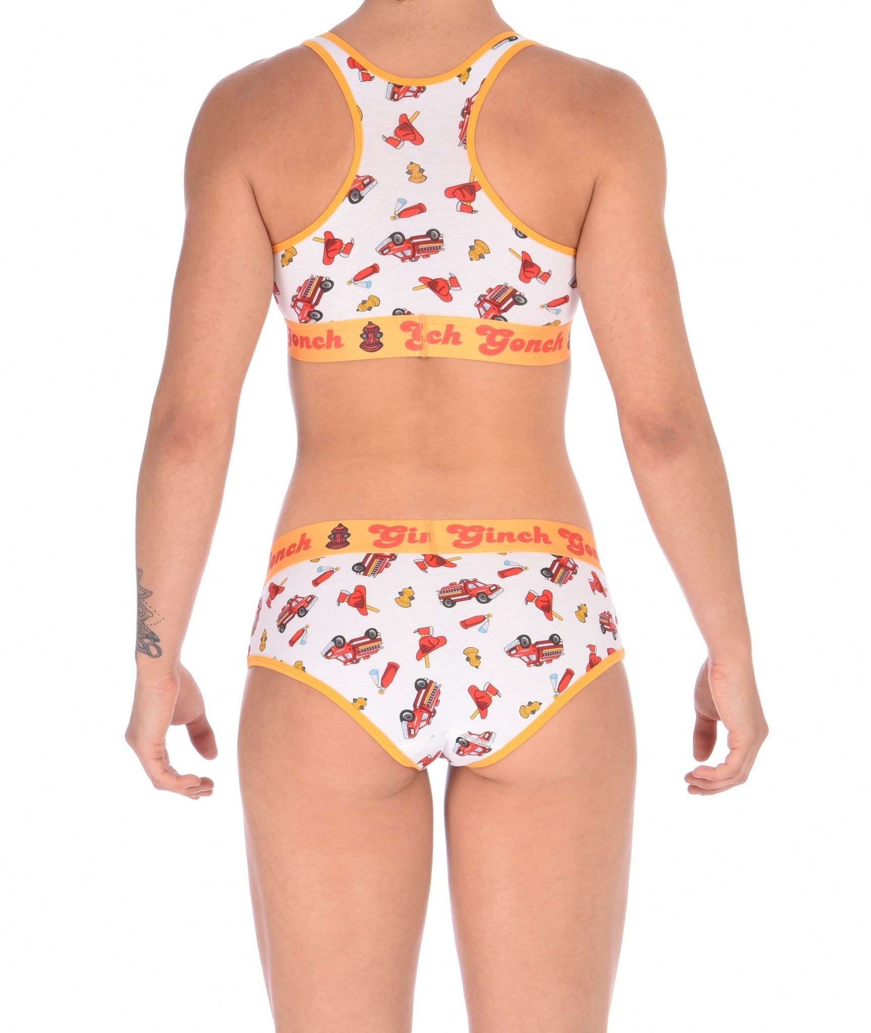Ginch Gonch GG Fire Fighters boy cut Brief womens y front underwear white fabric with fire engines hats and hydrants, yellow trim and yellow printed waistband back shown with matching sports bra