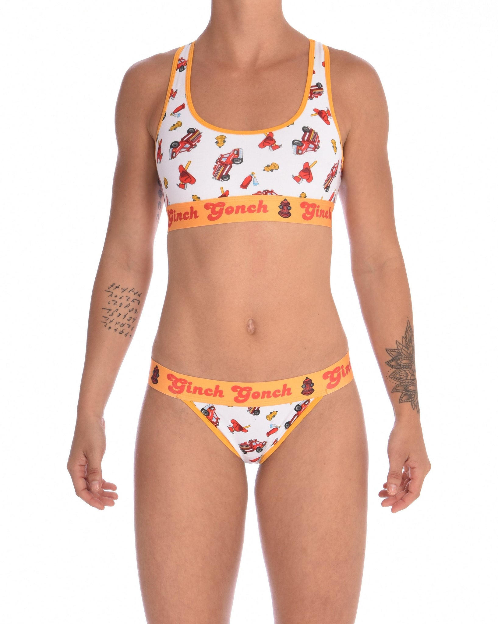 Ginch Gonch GG Fire Fighters thong women's underwear y front white fabric with fire engines hats and hydrants, yellow trim and printed yellow waistband front shown with matching sports bra